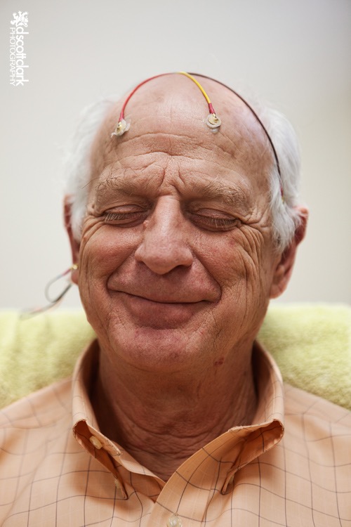 Older Man Getting Neurotherapy and Smiling